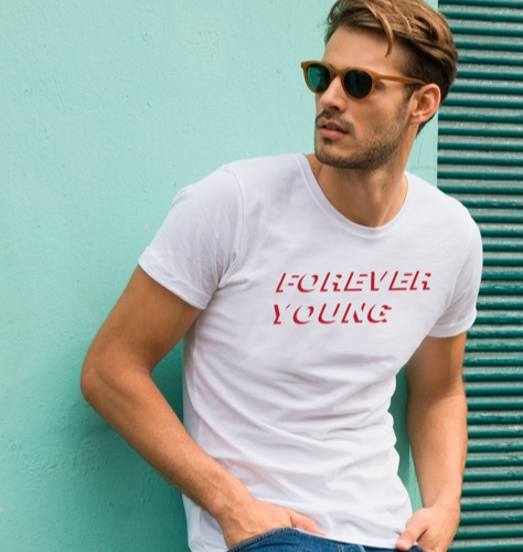 Man wearing a white T-shirt with a Forever Young design