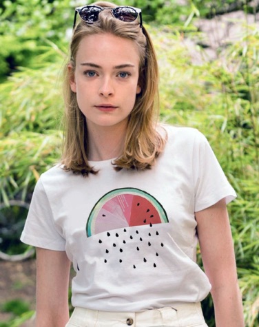 Woman wearing a white T-shirt with a watermelon motif