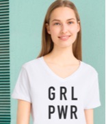 Woman wearing a white GRL PWR girl power T-shirt