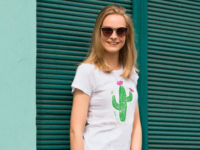 Woman wearing a white T-shirt with a cactus motif