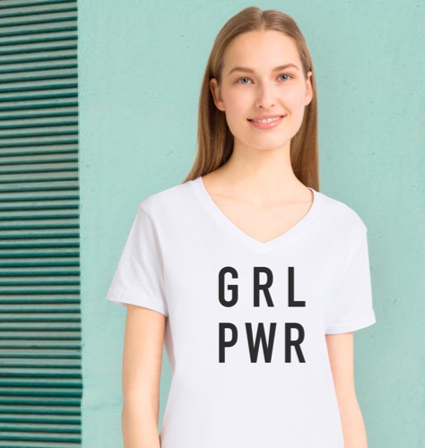 Woman wearing a white GRL PWR girl power T-shirt